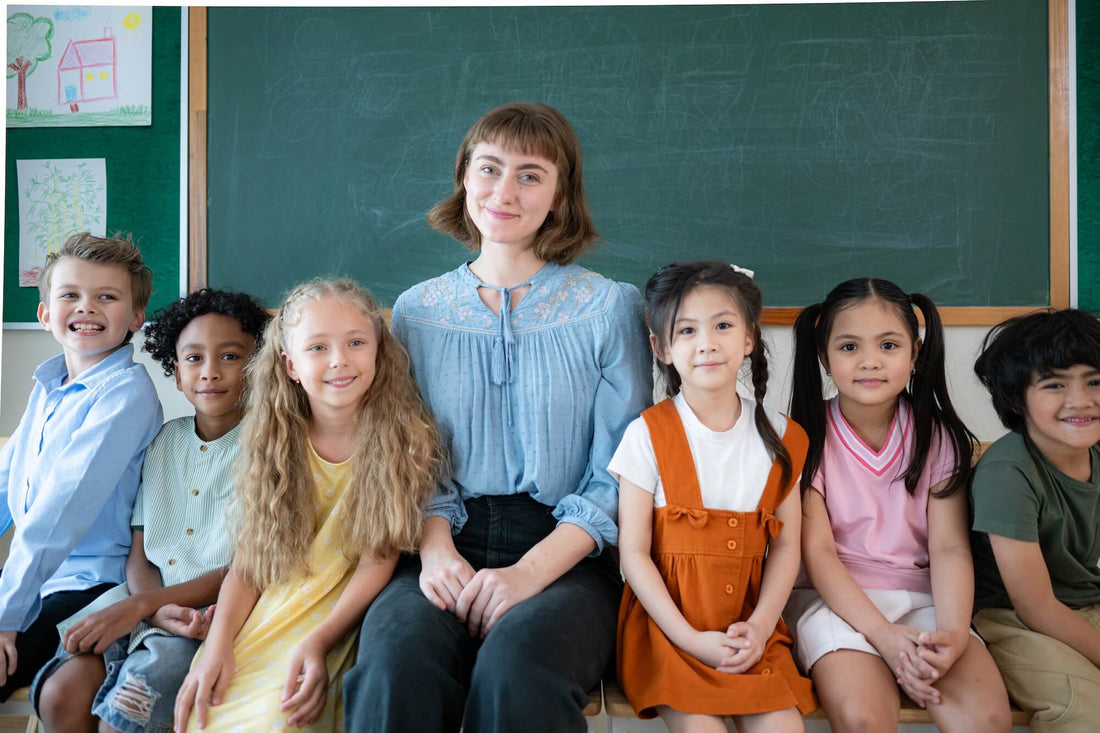 A teacher sitting with students